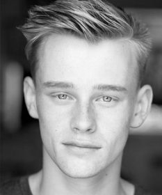 A black and white headshot of Barney Wilkinson