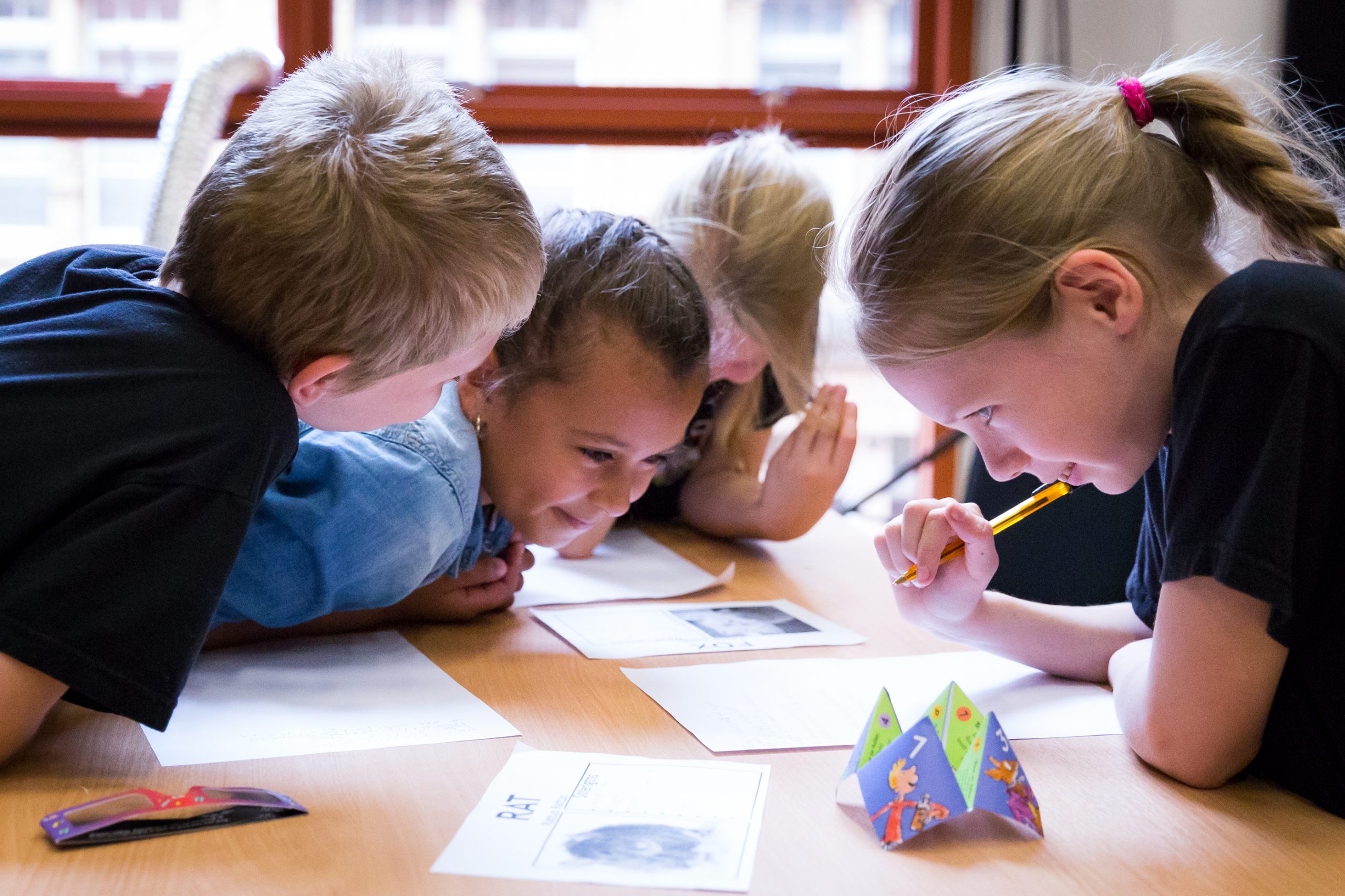 Four children participating in a poetry workshop.