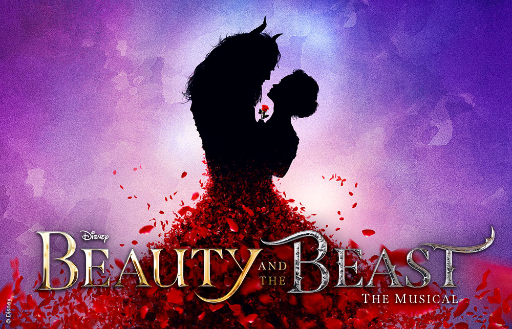 Promotional artwork for Beauty and the Beast. Belle and the Beast embrace in silhouette holding a red rose, against a blue and purple toned background. Red rose petals cascade from their waists. Text: Disney, Beauty and the Beast, The Musical.