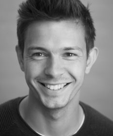 A black and white headshot of Dougie Carter.