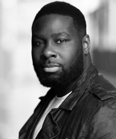 A black and white headshot of actor KM Drew Boateng.