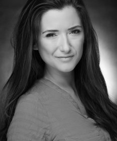 A black and white headshot of Rosie Fleeshman